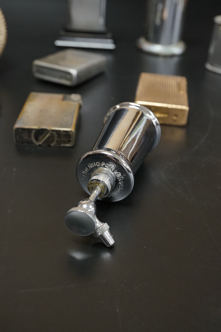 Ten assorted lighters including two Dunhill examples, a Ronson and Dupont, largest 12cm high